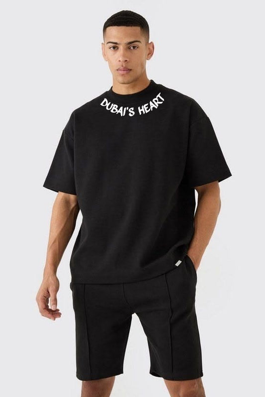 Man wearing the black Dubai's Heart oversized tee with the Dubai's Heart neckline print