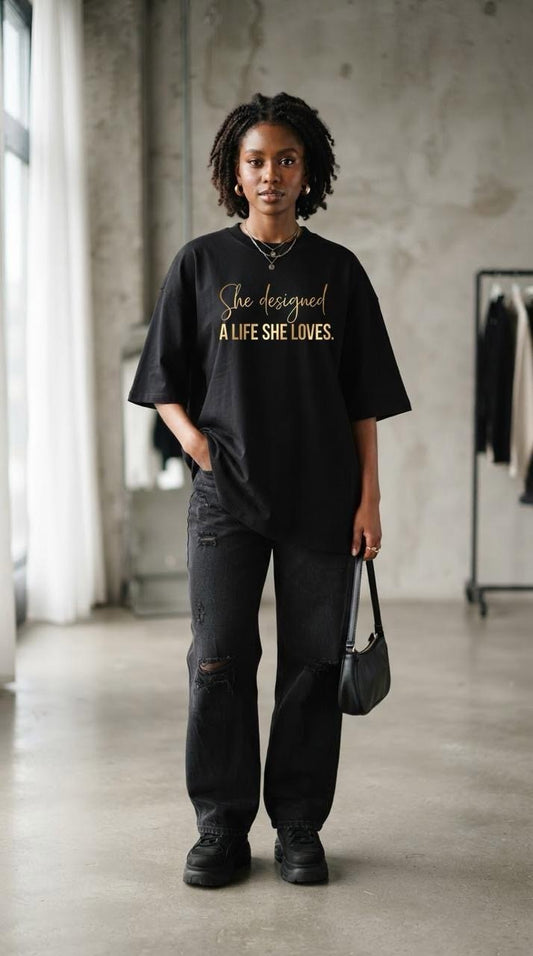 Woman in the black A Life She Loves oversized tee with gold script, full length
