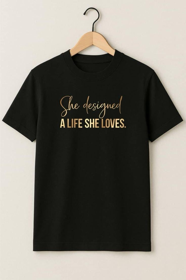 Black A Life She Loves oversized tee with gold script print on a hanger