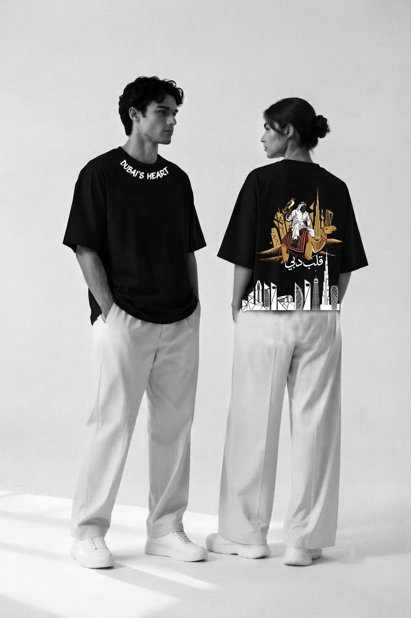Couple wearing black Dubai's Heart oversized tees, front and back prints