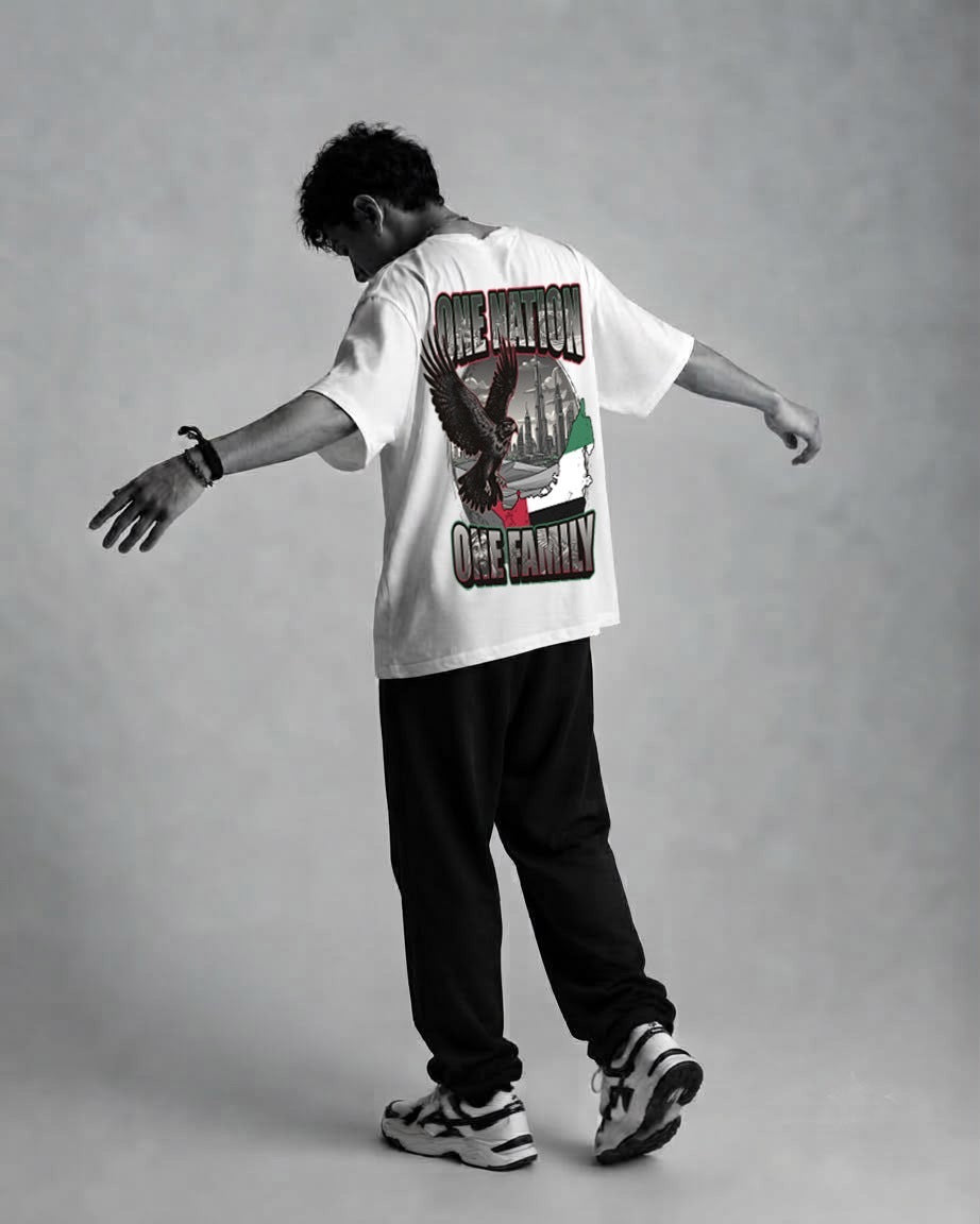 Man showing the One Nation One Family back print on the white RB Wovens oversized tee