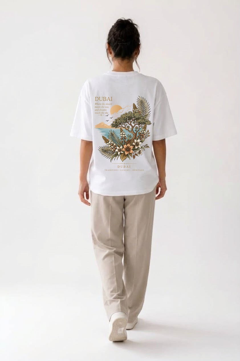 Woman wearing the white Dubai Oasis oversized tee, back print view